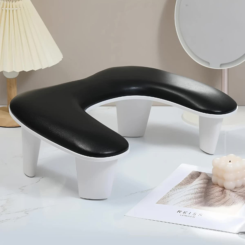 BLACK This handheld nail care device integrates a U-shaped pillow and comes with a portable detachable stand. Designed with an inclined PU material and a sturdy base, it is crafted for both comfort and portability.